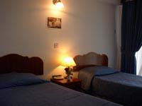 Standard double and 1 child with sea view, balcony, an extra bed, private facilities (bath and shower), and breakfast